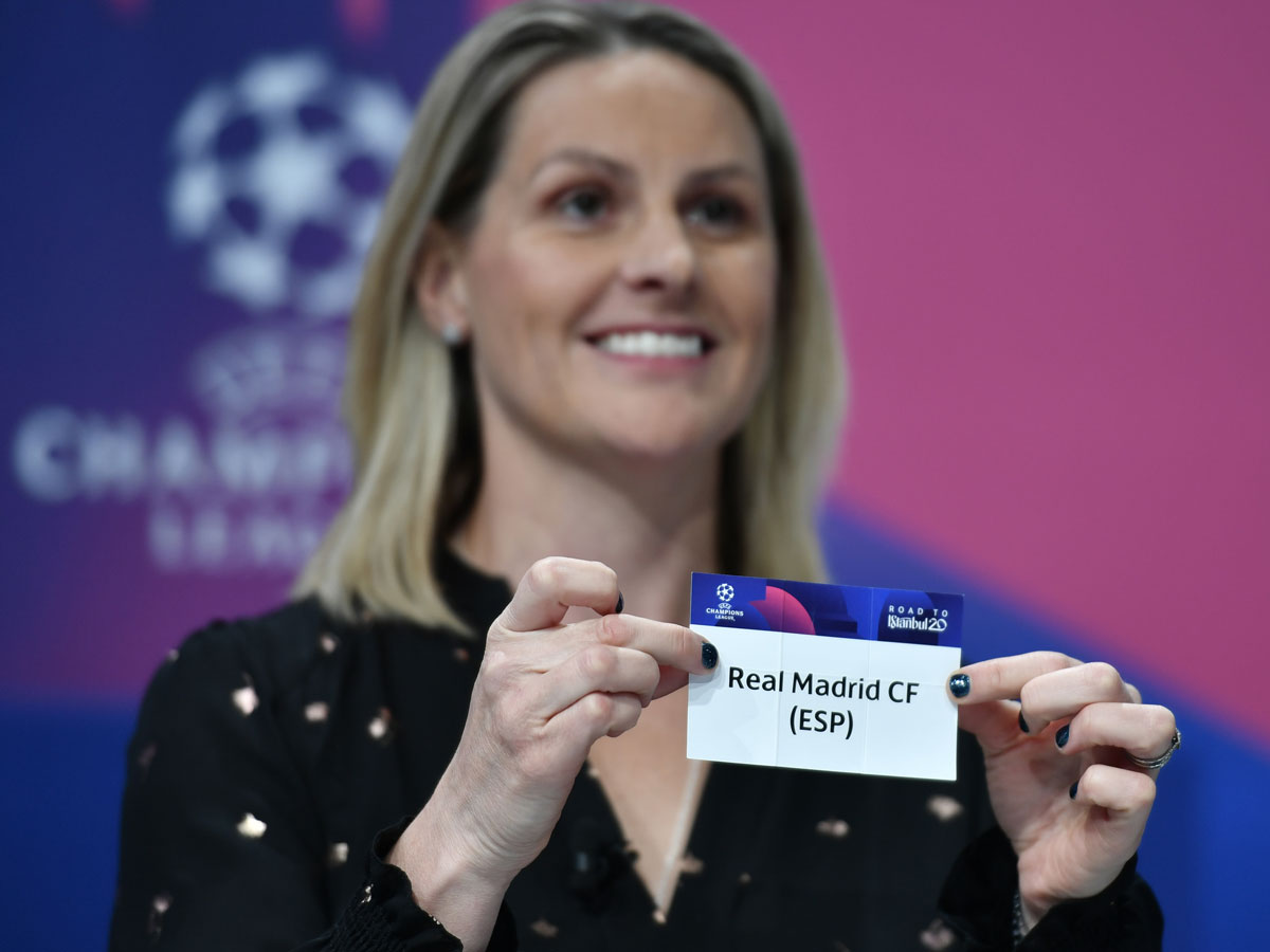 UEFA Champions League ambassador Kelly Smith holds the slip of Real Madrid during the UEFA Champions League football cup round of 16 draw ceremony on December 16, 2019 in Nyon.