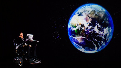 (FILES) In this file photo taken on March 24, 2017, renowned physicist Stephen Hawking, 75, speaks to an audience by hologram (L) in Hong Kong, beamed live from his office in Cambridge, England. Renowned British physicist Stephen Hawking has died at age 76, a family spokesman said Wednesday, March 14, 2018. We are deeply saddened that our beloved father passed away today," professor Hawking's children, Lucy, Robert, and Tim said in a statement carried by