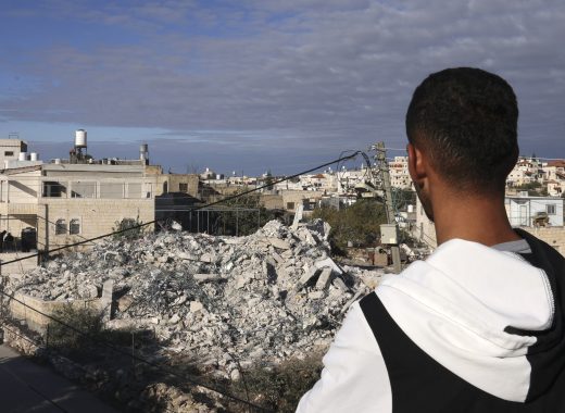 A Palestinian man looks at the remains of a house, after it was demolished by Israeli bulldozers, in the village of Idna, near the West bank town of Hebron on November 27, 2024. (Photo by HAZEM BADER / AFP)